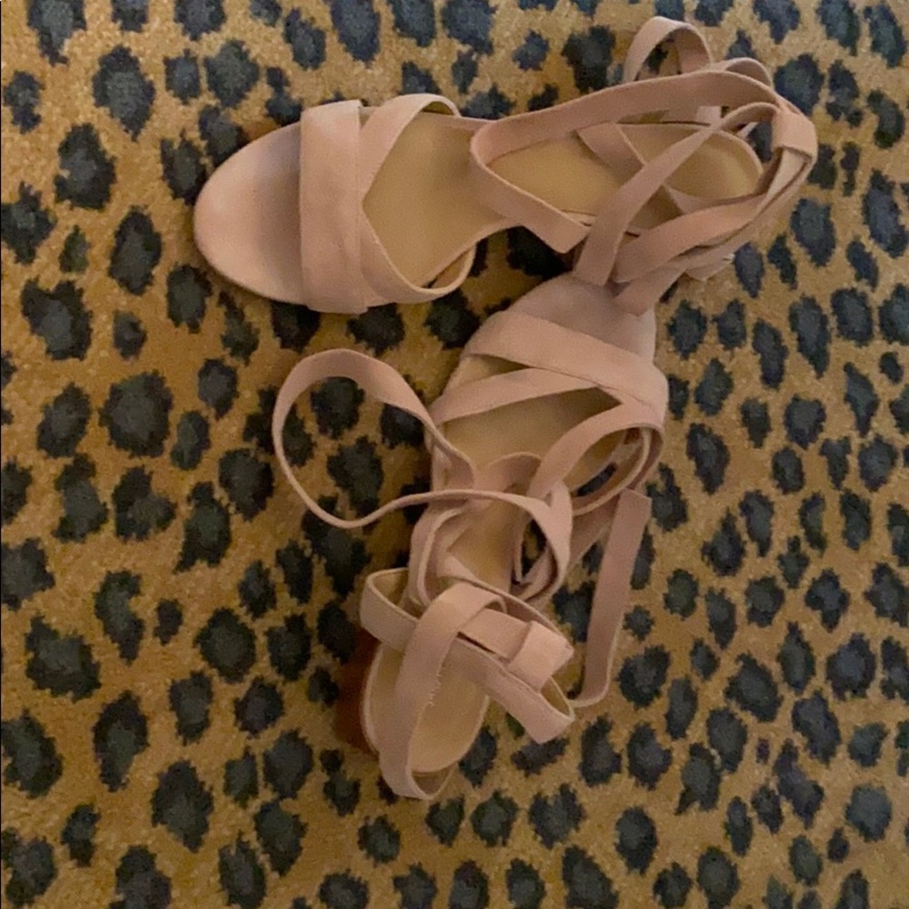 Blush colored sandals that have ties